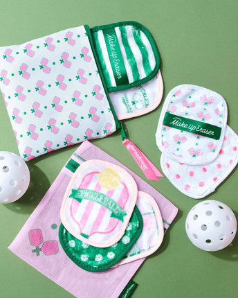 Make-up erasers with strawberry design on a green background