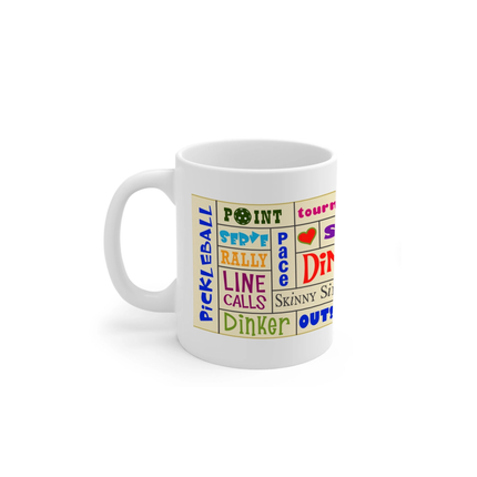 White mug with colorful pickleball-themed text on a white background