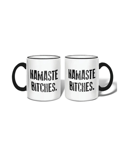 Two white mugs with black text 'Namaste Bitches' on a white background