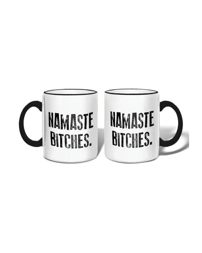 Two white mugs with black text 'Namaste Bitches' on a white background
