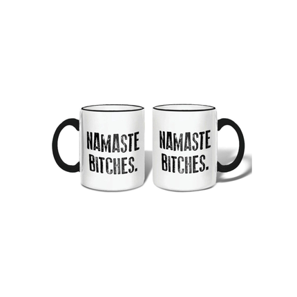Two white mugs with black text 'Namaste Bitches' on a white background