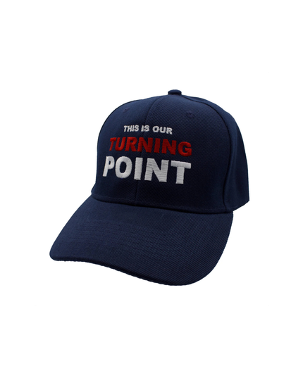 Navy blue cap with text 'THIS IS OUR TURNING POINT' on a white background
