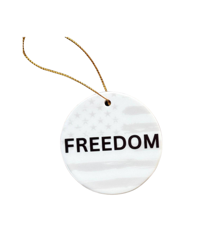 Round white tag with 'FREEDOM' text and a string on a white background