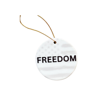 Round white tag with 'FREEDOM' text and a string on a white background