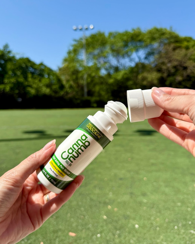 Two bottles of Canna Nudo product held by hands with a green outdoor background