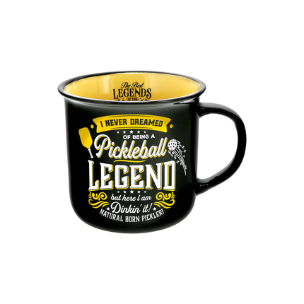 Black mug with yellow text and pickleball graphics on a white background