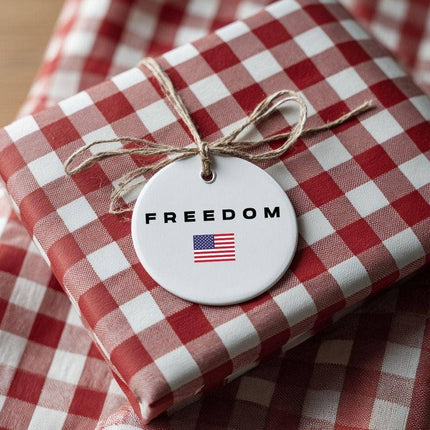 Gift wrapped in red and white checkered paper with a 'FREEDOM' tag featuring an American flag.