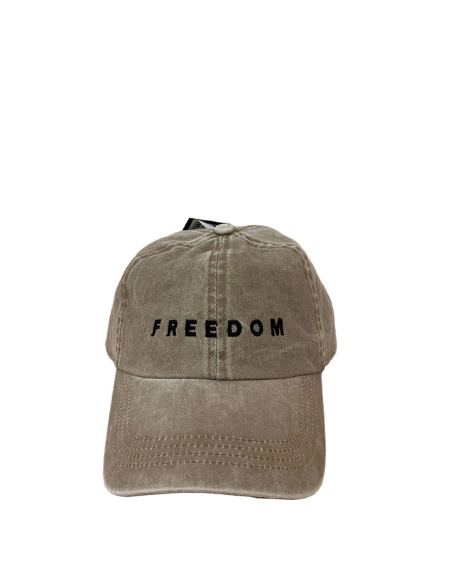 Beige cap with 'FREEDOM' text on a beige distressed hat