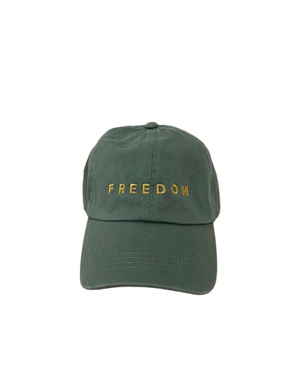 Green cap with 'FREEDOM' text on a green hat