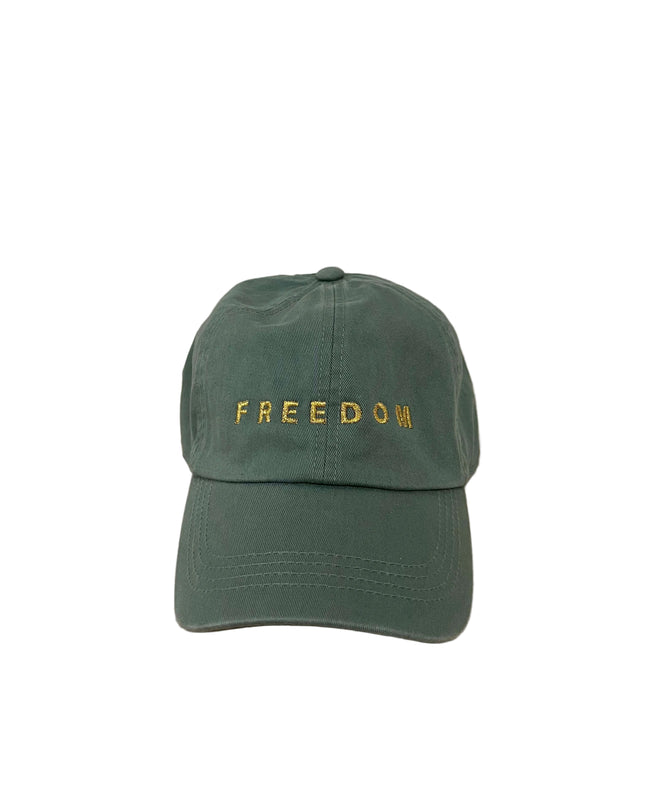 Green cap with 'FREEDOM' text on a green hat